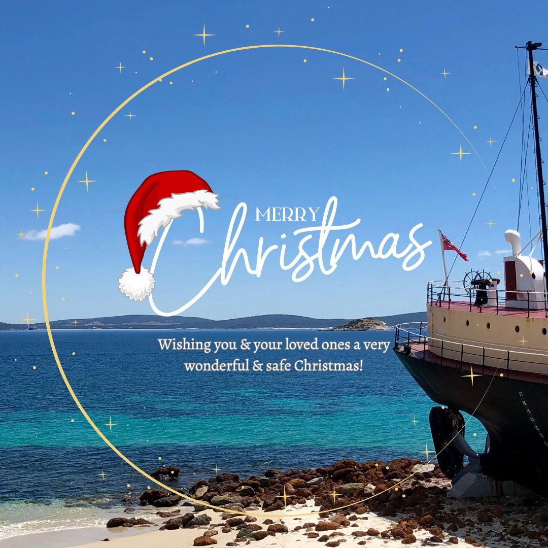 Merry Christmas text with ship and ocean photo in background